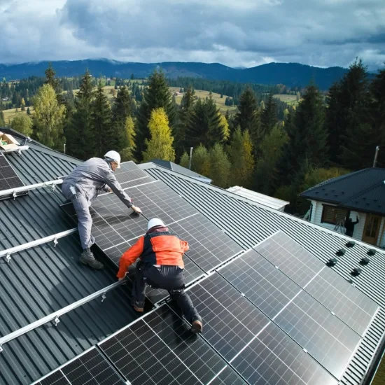 Solar energy technician holding a photovoltaic panel