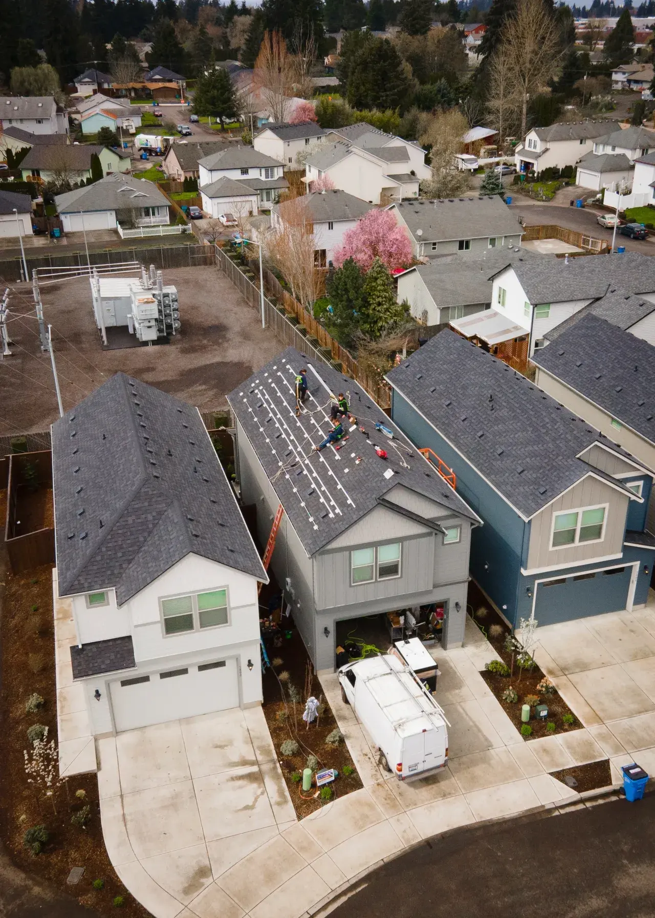 Solar installation crew working on a residential roof