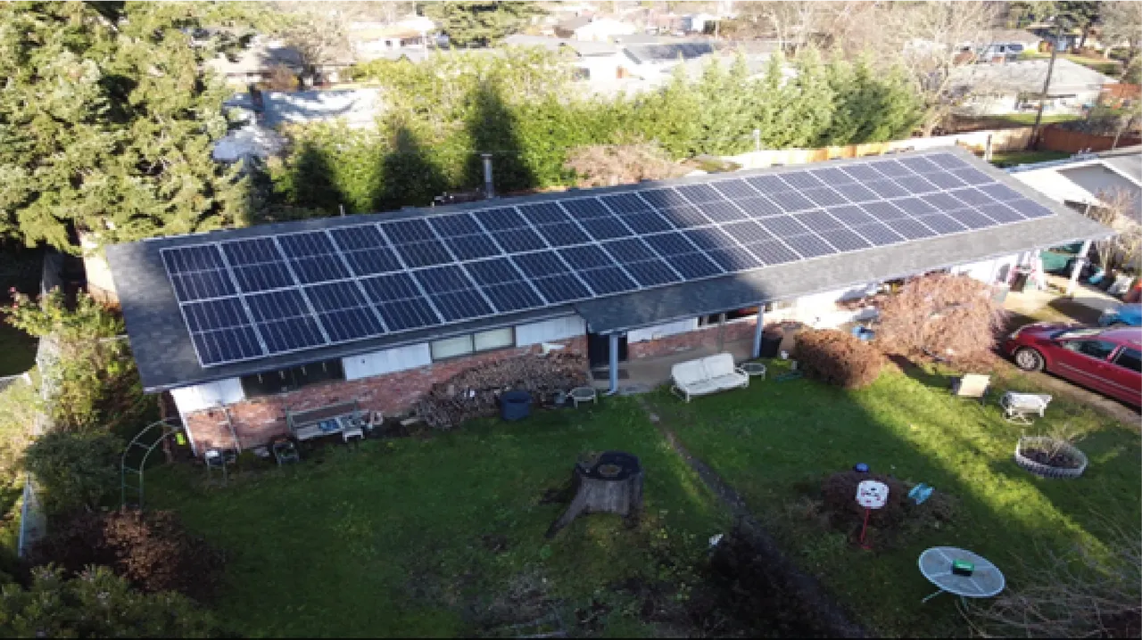 Residential solar panels installed across a long roof